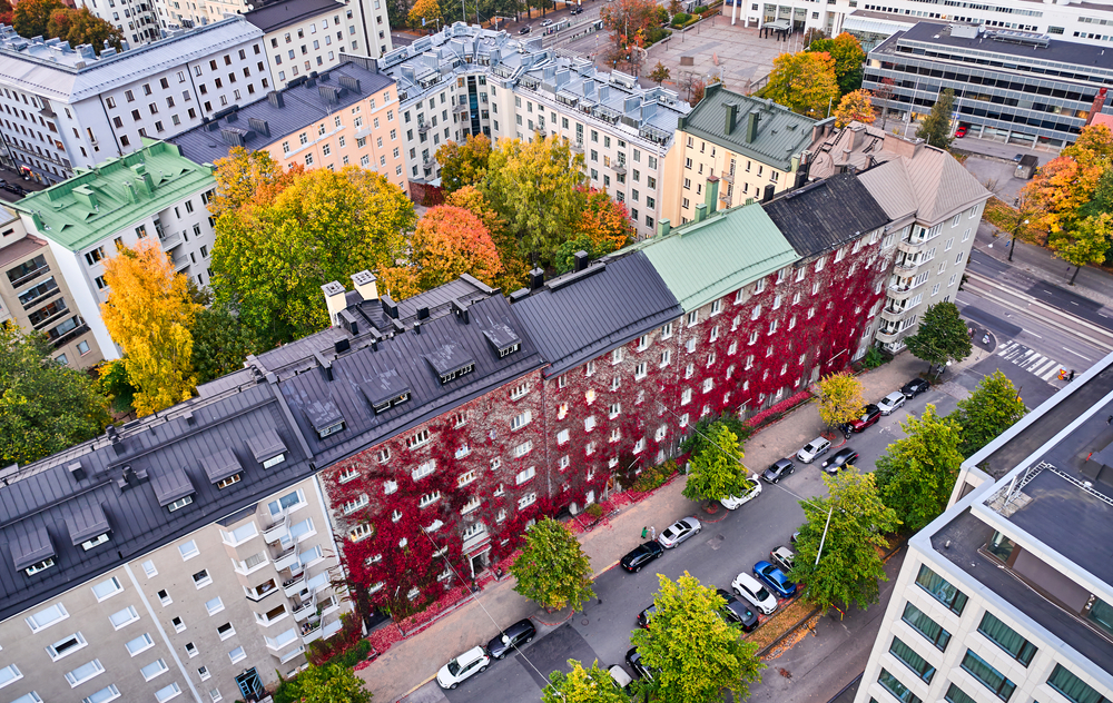 man and woman sitting in front of silver macbook